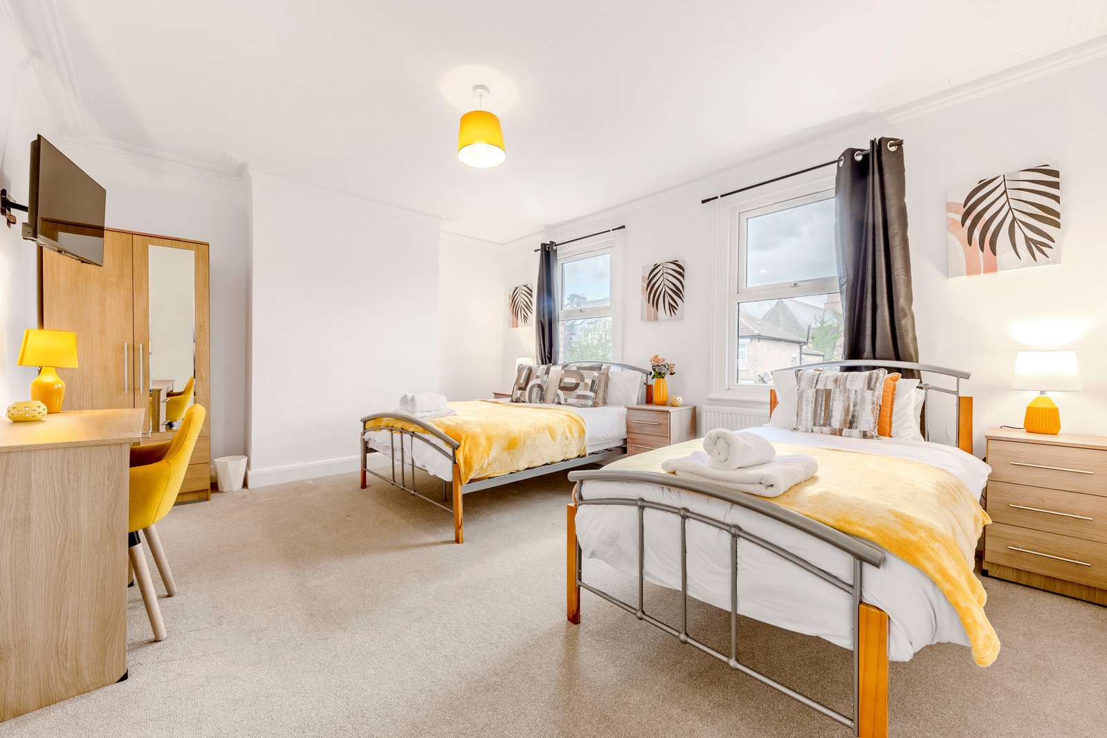 Bedroom 3 — yellow room, twin beds
